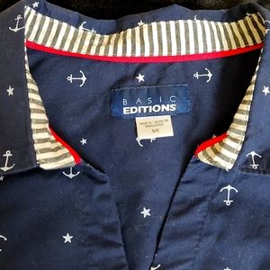 Fitted woman's top. Navy blue with little white anchors.